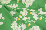 Tissu coton vert avec motifs de chênes et feuillage