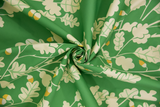 Tissu coton vert avec motifs de chênes et feuillage