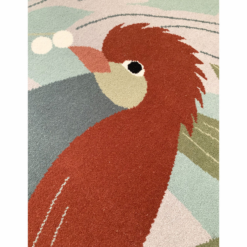 détail oiseaux rouge tapis en laine